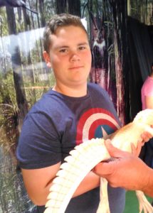 Luke Heird holding a scaly creature
