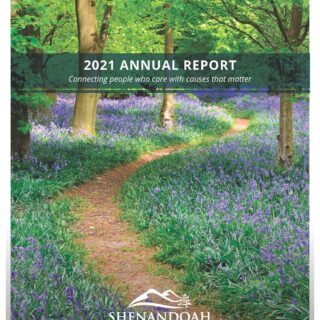 2021 annual report cover of path through woods with Virginia Bluebells